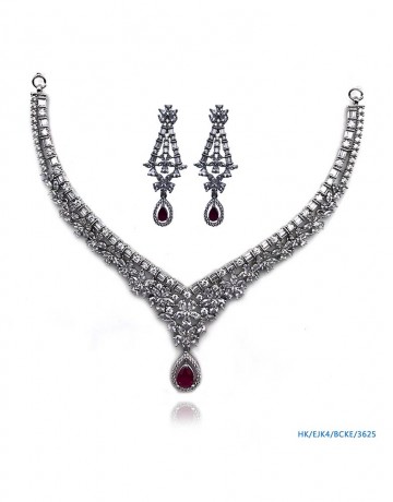 Elegant designer necklace set with the red semi-precious stone drop.